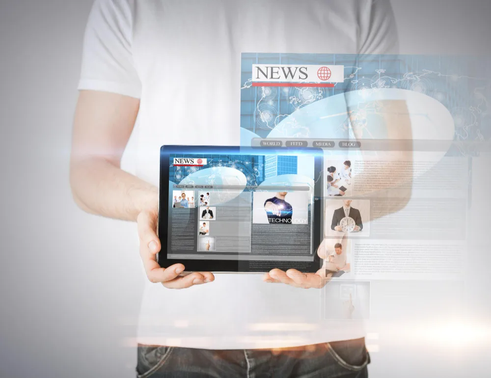 A person holding a tablet with a digital seo press releases on it.