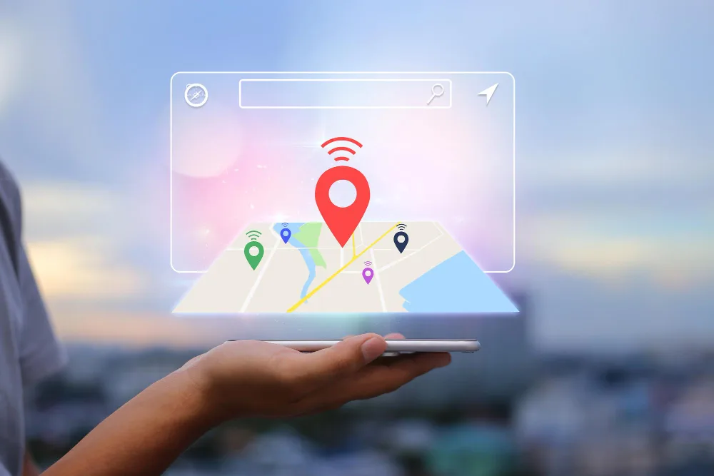 A person holding a phone with a map location popping out symbolizing Local SEO.