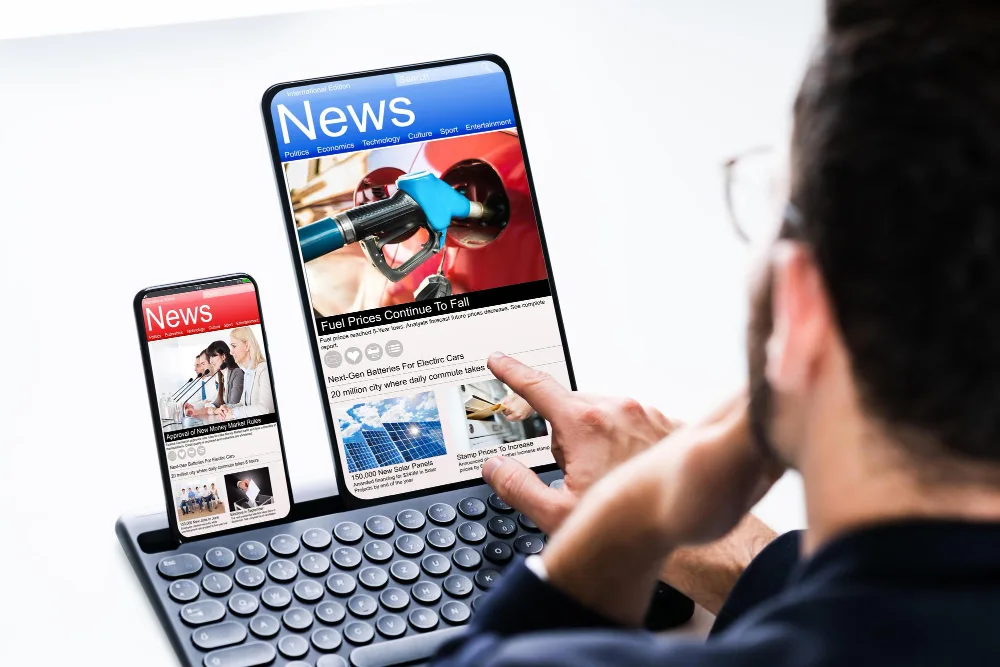A person using a laptop to view a press release